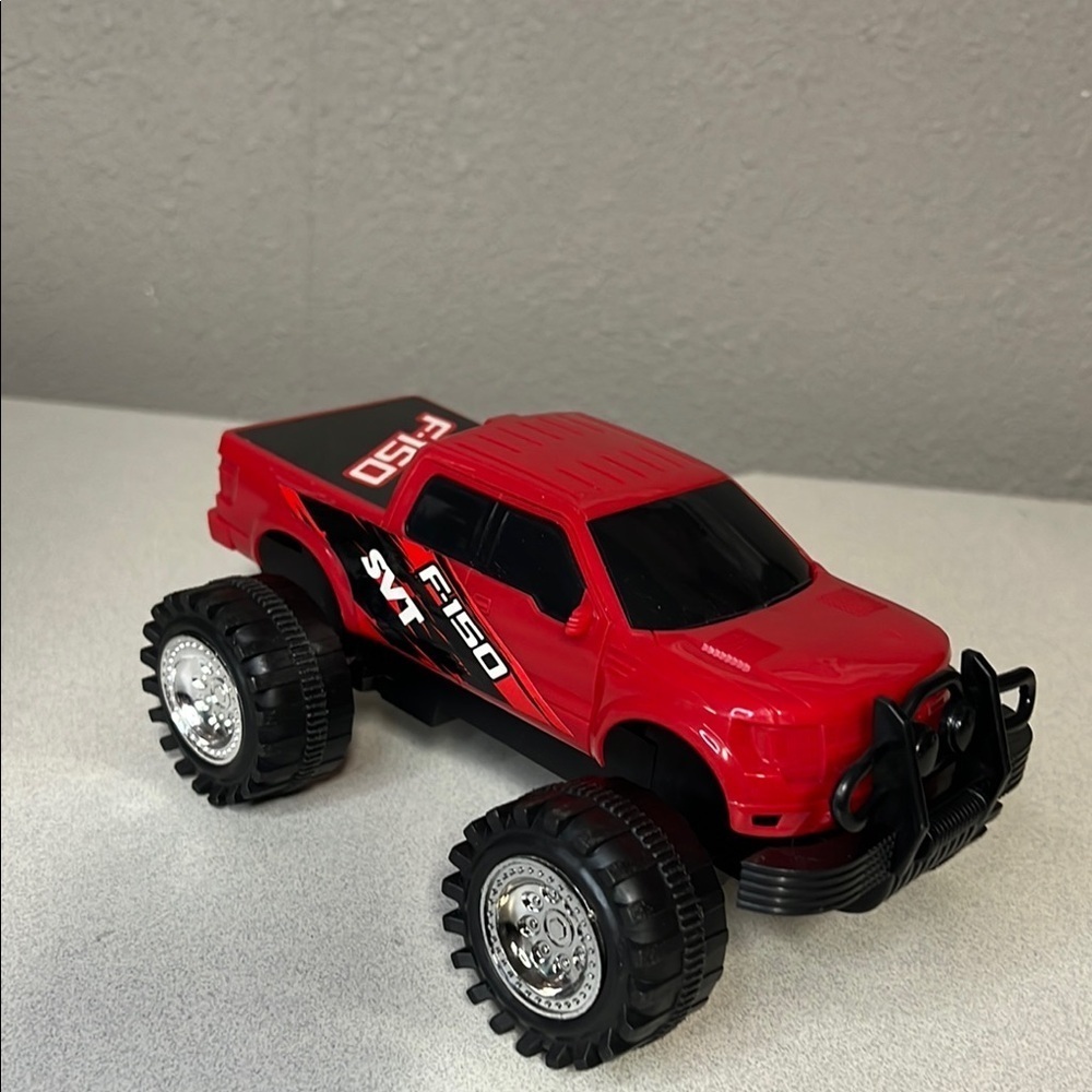Red and Black Off-Road Toy Vehicles